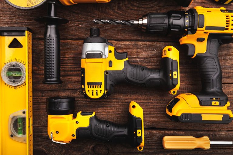 construction-carpentry-tools-electric-corded-circular-saw-cordless-drill-background-scaled